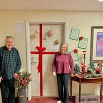 Salmon Creek Gracious Retirement Living Hawthorn Senior Independent Living in Boise, Idaho residents decorating their doors for the holidays