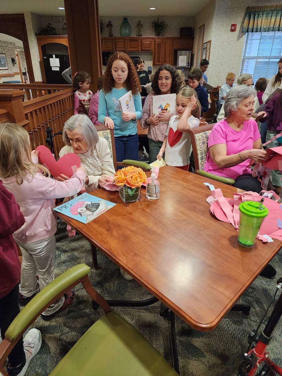 Allisonville Meadows Assisted Living offering assisted living, memory care, and respite care in Fishers, IN, residents interacting with kids in the community