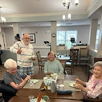 Bennett Place in New Albany, IN, residents enjoying a treat during a birthday celebration