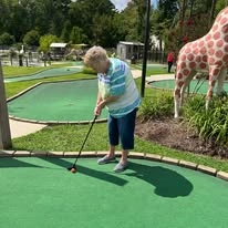 Colonial Harbor Gracious Retirement Living Hawthorn Senior Independent Living in Yorktown, Virginia resident mini golfing