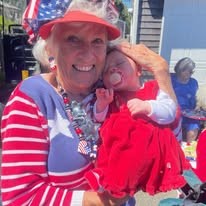 Avamere at Seaside Senior Living in Oregon resident holding a baby