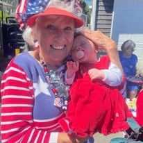 Avamere at Seaside senior living community offering independent living, assisted living, memory care, and respite care in Seaside, OR, resident holding a baby doll