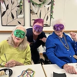 The Waters of Plymouth residents celebrating Mardi Gras at their party