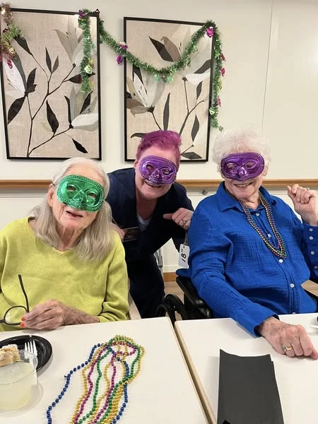 The Waters of Plymouth residents celebrating Mardi Gras at their party