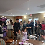 American House Sterling Heights, senior living community offering independent living and respite care in Sterling Heights, MI, residents with family during a celebration