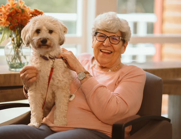 older woman and her white dog