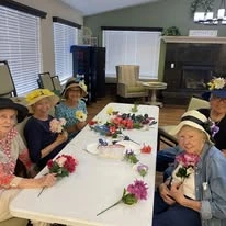 Paloma Landing Retirement Community Hawthorn Senior Independent Living in Albuquerque, New Mexico residents making flower bouquets