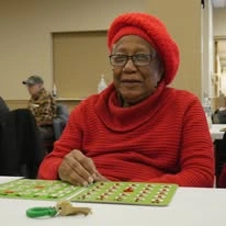Avina of Milwaukee Senior Living assisted living and independent living in Milwaukee, WI, resident playing bingo