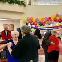 Salmon Creek Gracious Retirement Living Hawthorn Senior Independent Living in Boise, Idaho residents dancing at a party