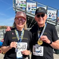 Ovation Sienna Hills Senior Living in Washington, Utah residents with medals after a race
