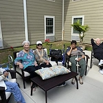 Plantation Oaks Assisted Living & Memory Care in High Springs, FL, residents enjoying time together outside