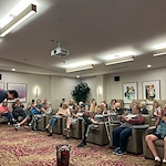 CopperWood at Prairie Trail senior living community offering assisted living and memory care in Ankeny, IA, residents enjoying entertainment
