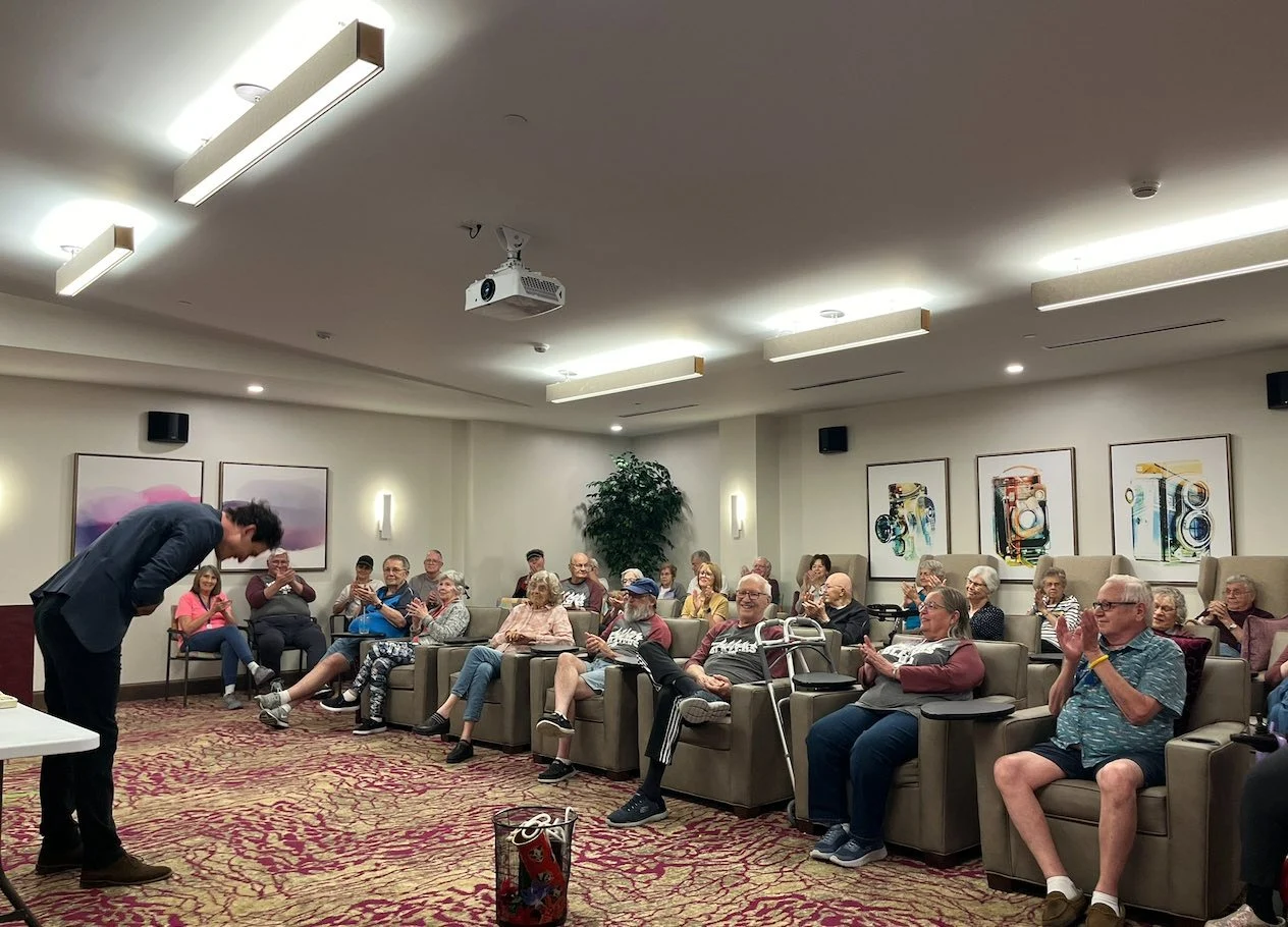 CopperWood at Prairie Trail senior living community offering assisted living and memory care in Ankeny, IA, residents enjoying entertainment