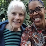 Harvester Place Senior Assisted Living Memory Care in Burr Ridge, IL resident smiling with a staff member