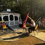 Colonial Harbor Gracious Retirement Living Hawthorn Senior Independent Living in Yorktown, Virginia residents doing a fitness class outside