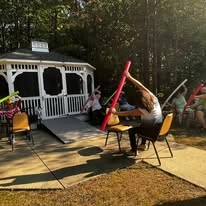 Colonial Harbor Gracious Retirement Living Hawthorn Senior Independent Living in Yorktown, Virginia residents doing a fitness class outside
