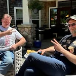 Avamere at Seaside senior living community offering independent living, assisted living, memory care, and respite care in Seaside, OR, residents holding a "peace" sign while enjoying time outdoors