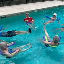 Cypress Springs Gracious Retirement Living Hawthorn Senior Independent Living in Lakewood Ranch, Florida residents lounging in the pool