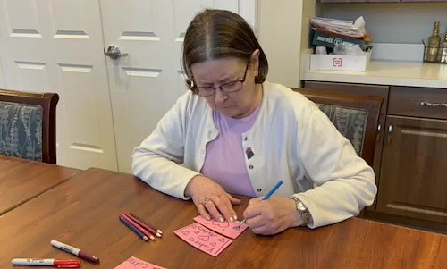 Residents Make Valentine Coffee Sleeves for Biggby Coffee Customers