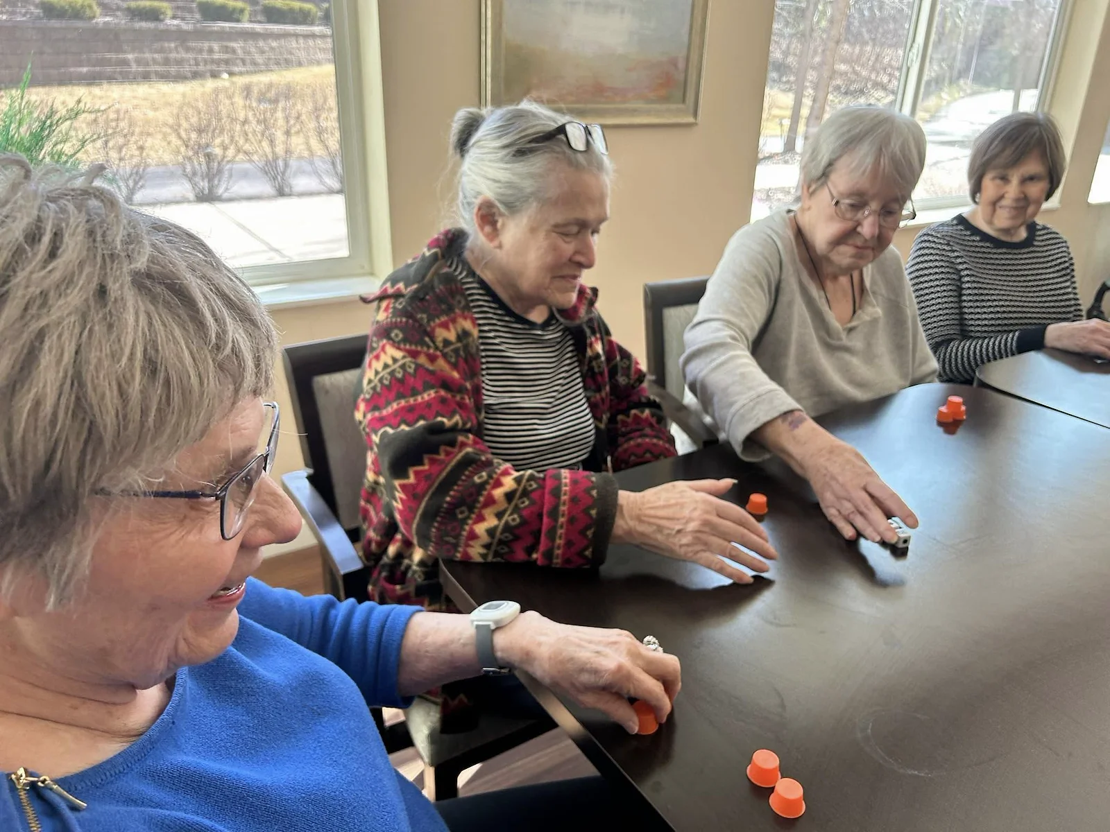 Residents of the Waters of Edina play a new board game