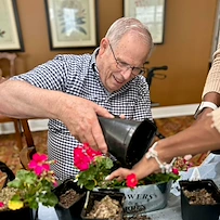 Highgrove at Tates Creek Lexington, KY, resident enjoys activity - planting flowers