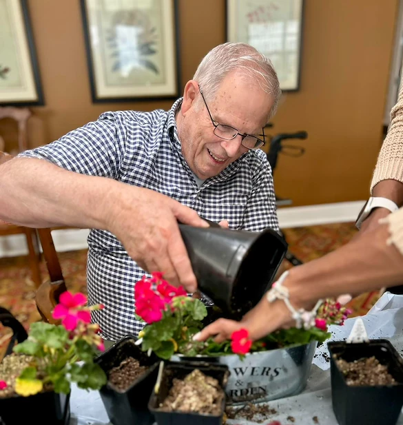 Highgrove at Tates Creek Lexington, KY, resident enjoys activity - planting flowers