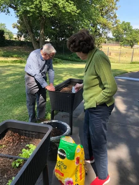 community members planting a garden