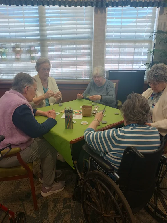 Allisonville Meadows Assisted Living offering assisted living, memory care, and respite care in Fishers, IN, residents enjoying doing arts and crafts together