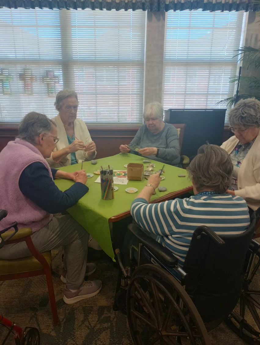 Allisonville Meadows Assisted Living offering assisted living, memory care, and respite care in Fishers, IN, residents enjoying doing arts and crafts together