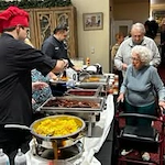 El Dorado Estates Gracious Retirement Living Hawthorn Senior Independent Living in El Dorado Hills, California residents going through food line
