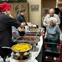 El Dorado Estates Gracious Retirement Living Hawthorn Senior Independent Living in El Dorado Hills, California residents going through food line