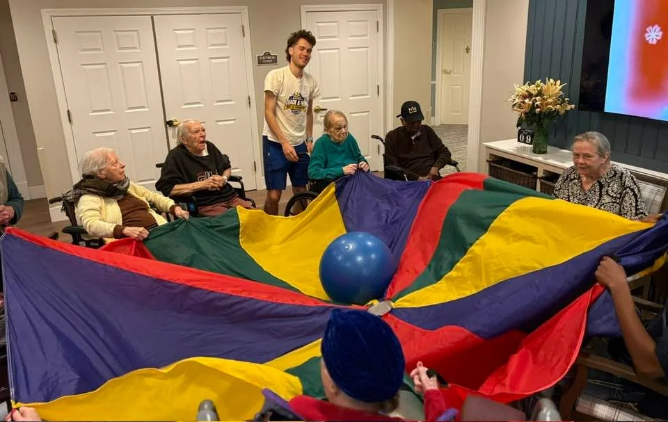 Charter Senior Living of Dedham in Dedham, MA, residents staying active with a fun activity