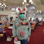 Summerville Estates Gracious Retirement Living Hawthorn Senior Independent Living in Summerville, South Carolina resident dressed up for Christmas party