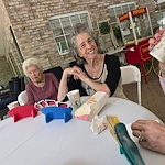 The Glenwood of Gainesville, Florida, residents enjoying playing cards together outside