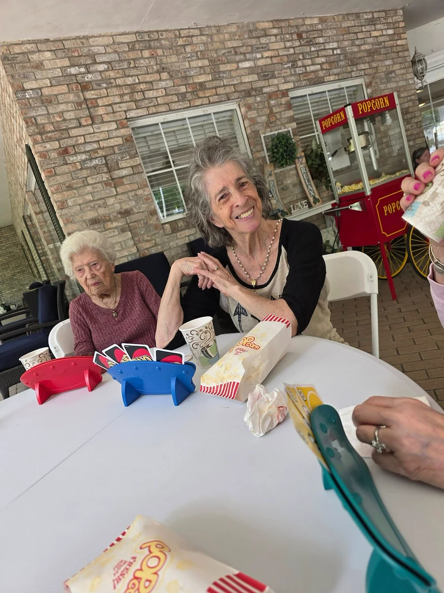 The Glenwood of Gainesville, Florida, residents enjoying playing cards together outside