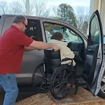 Northridge Gracious Retirement Living Hawthorn Senior Independent Living in Fishers, Indiana resident in a wheelchair being helped into a vehicle