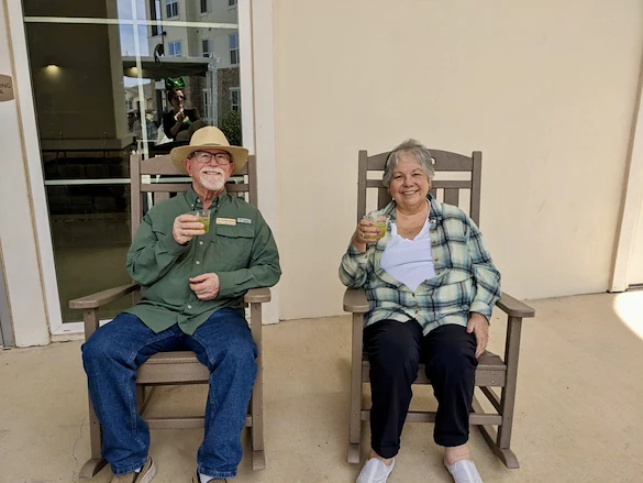 Wilshire Senior Living, independent living, assisted living, and memory care in Burleson, TX, residents enjoying a cocktail