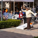 Covenant Living at the Samarkand in Santa Barbara, CA, resident enjoying an outdoor activity - cornhole