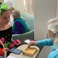 Whispering Pines Gracious Retirement Living Hawthorn Senior Independent Living in Raleigh, North Carolina resident playing a game