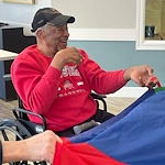 Dublin Glenn Memory Care in Ohio happy resident having fun during an activity