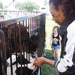 Porter Place Assisted Senior Living Memory Care in Tinley Park, IL resident at a petting zoo