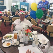 Cottonwood Estates Gracious Retirement Living Hawthorn Senior Independent Living in Alpharetta, Georgia resident at his birthday party