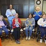 American House Stone senior living community offering independent living and respite care in Rochester Hills, MI, residents making music