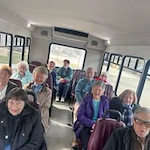 Fairview Estates Gracious Retirement Living Hawthorn Senior Independent Living in Hopkinton, Massachusetts residents on a transportation bus
