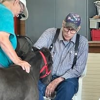 Alexis Estates Gracious Retirement Living Hawthorn Senior Living community in Allen, TX resident petting a horse