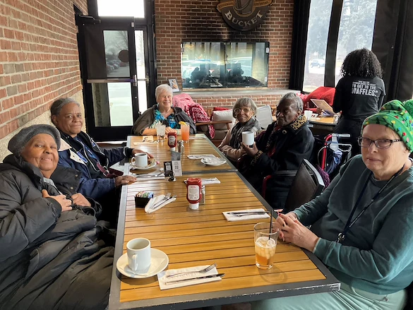 American House Farmington Hills, senior living community offering independent living, assisted living, memory care, and respite care in Farmington Hills, MI, residents enjoying a meal together