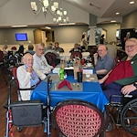 Charter Senior Living of Davison smiling residents dining together