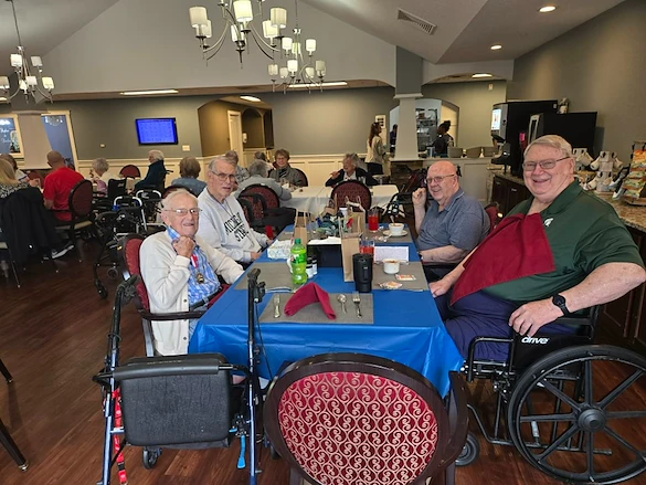 Charter Senior Living of Davison smiling residents dining together