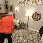 Avamere at St. Helens senior living community offering independent living, assisted living, memory care, and respite care in St. Helens, OR, residents playing darts