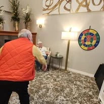 Avamere at St. Helens senior living community offering independent living, assisted living, memory care, and respite care in St. Helens, OR, residents playing darts